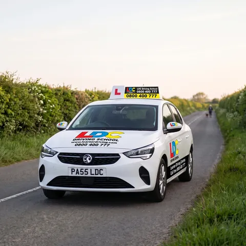 An LDC Driving School tuition car on a country lane